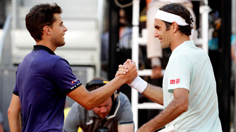 Dominiks Tīms un Rodžers Federers. Foto: EPA/Scanpix