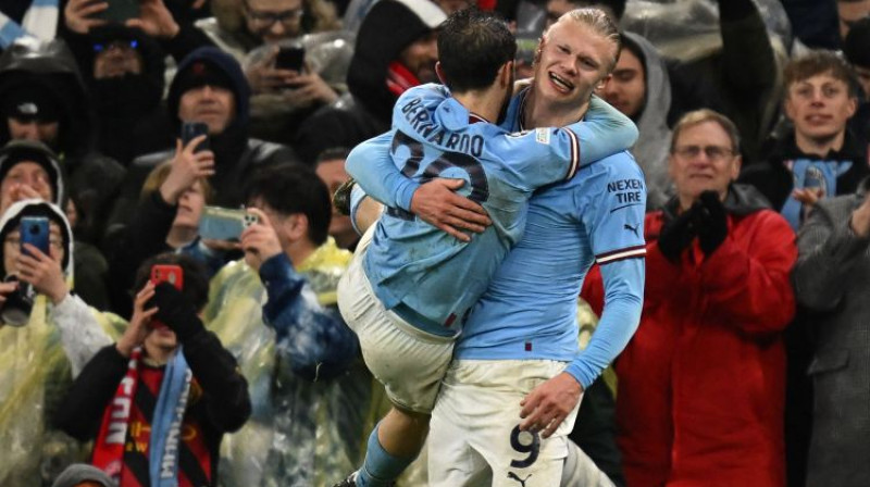 Bernardu Silva un Ērlings Holanns. Foto: AFP/Scanpix