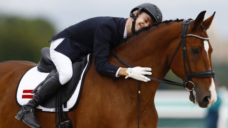 Rihards Snikus un King of the Dance. Foto: Reuters/Scanpix